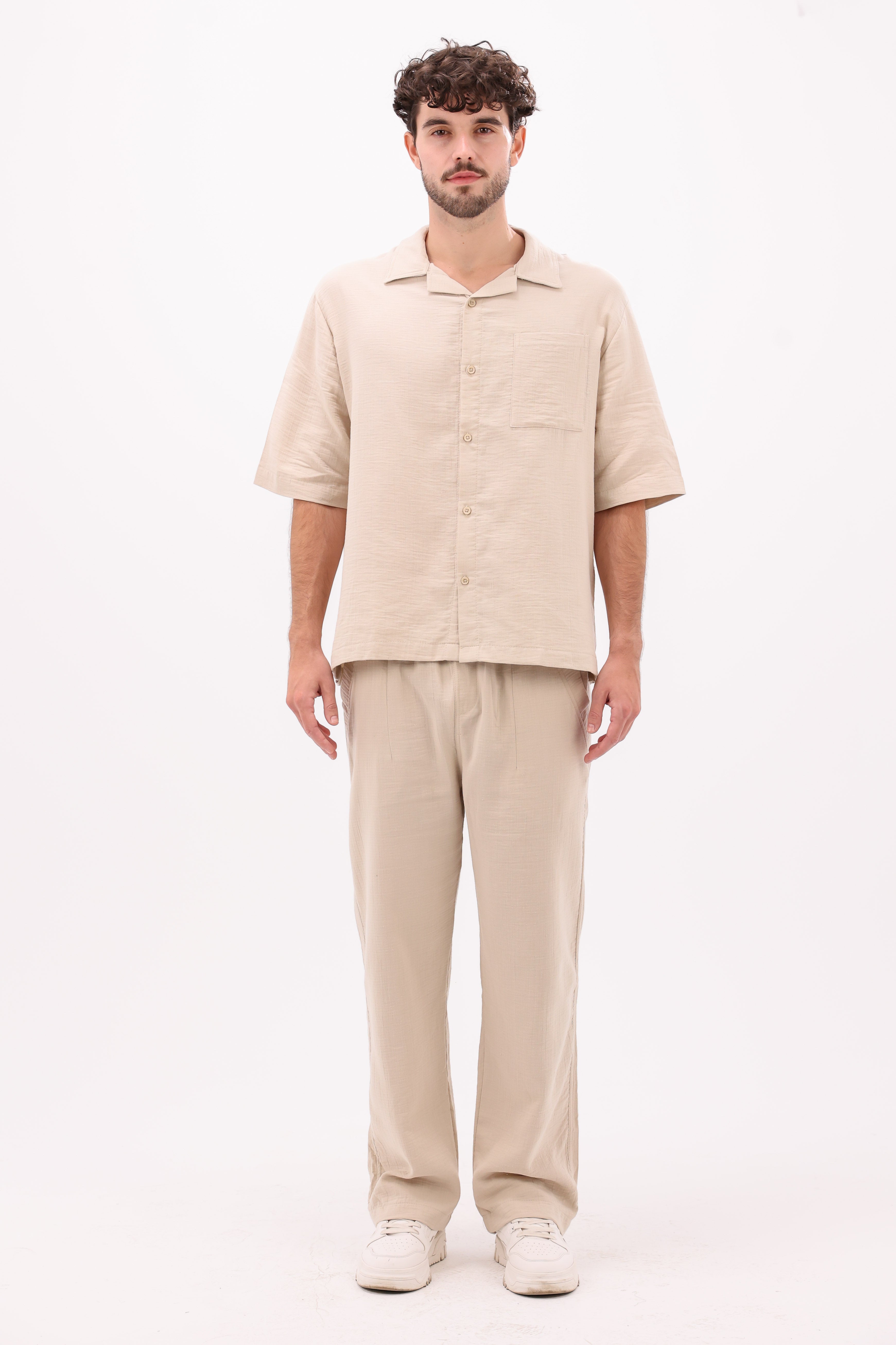 Front view of beige linen shirt with button-up style